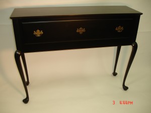 Hall Table made of solid Cherry with Queen Anne legs, mortise and tenon joinery and traditional hardware drawer pulls. Dimensions are 14 inches deep, 48 inches wide and 36 inches high. The piece is finished in a Dark Walnut stain, and top coated with multiple coats of water base polyurethane and wet sanded.